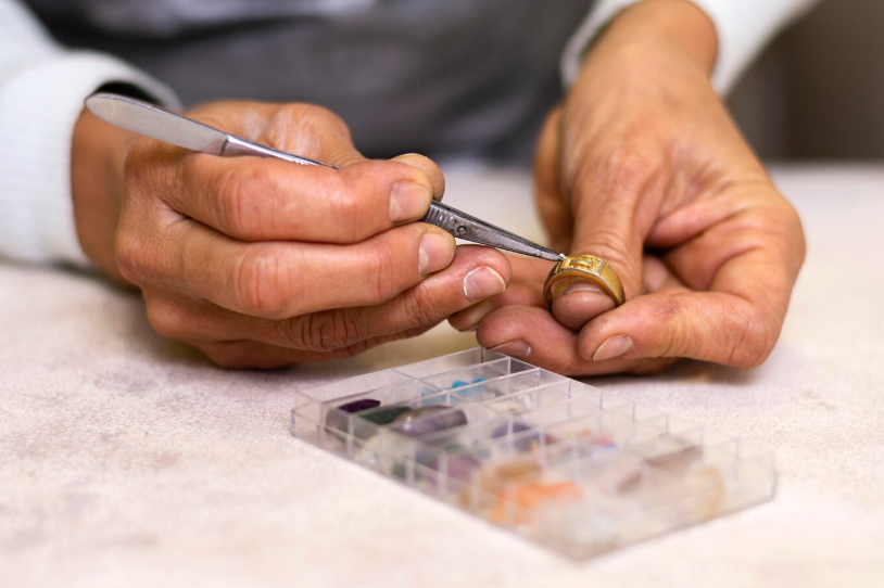 Inspecting gemstone ring Edmonton bullion